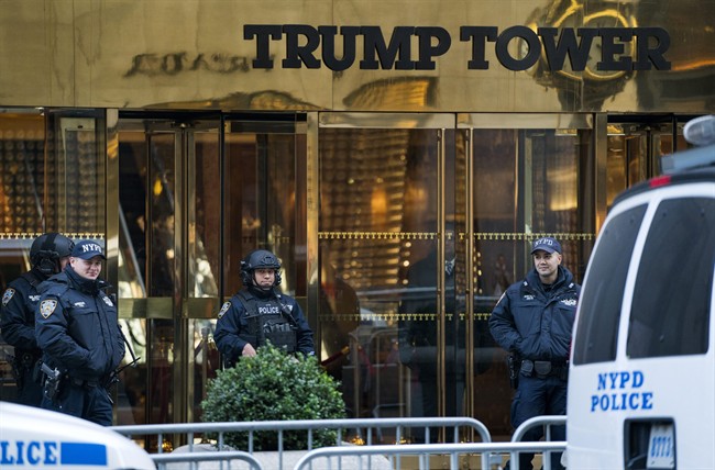 New York City police stand guard in front of Trump Tower, a residence of President-elect Donald Trump in New York, Sunday, Nov. 13, 2016. New Yorkers are protesting the financial burden of the security costs for the Trump family.