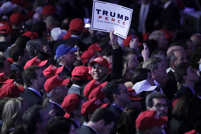 A supporter of Republican presidential candidate Donald Trump holds up a sign during his election night rally, Wednesday, Nov. 9, 2016, in New York.