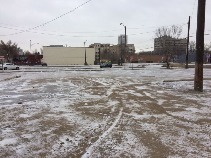 The site of a proposed downtown Edmonton park is currently a parking lot.