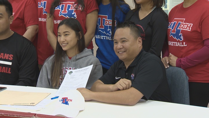Sisler Spartans point guard Raizel Guinto signs her letter of intent to join the NCAA's division one Louisiana Tech Lady Techsters.