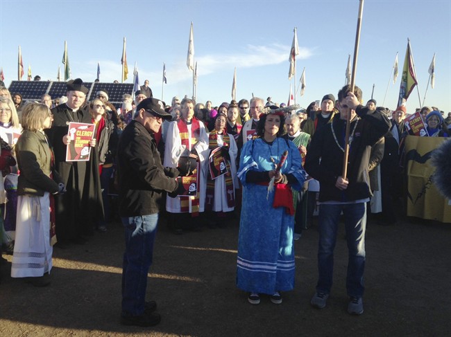 Members of the clergy join protesters against the Dakota Access oil pipeline in southern North Dakota near Cannon Ball on Thursday, Nov. 3, 2016, to draw attention to the concerns of the Standing Rock Sioux and push elected officials to call for a halt to construction. The tribe says the $3.8 billion, four-state pipeline threatens its drinking water and cultural sites.