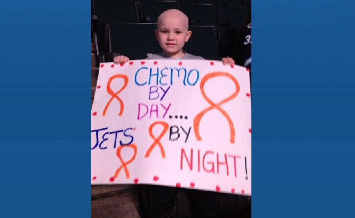 Popular Jets fan celebrates with players after finishing cancer treatments - image