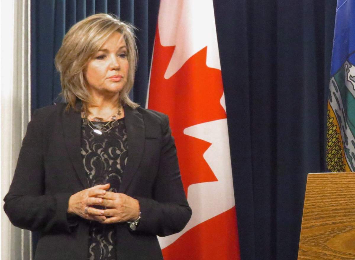 Sandra Jansen, the one-time candidate for the Alberta Progressive Conservative leadership has crossed the floor to the governing NDP over concerns the party is moving too far to the social right. Jansen, then a Progressive Conservative backbencher, looks on during a media availability at the Alberta Legislature in Edmonton in a Dec. 4, 2014, file photo. 