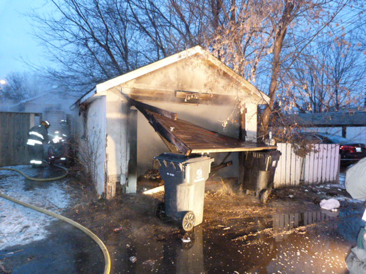 Saskatoon firefighters take eight minutes to bring garage fire under control.