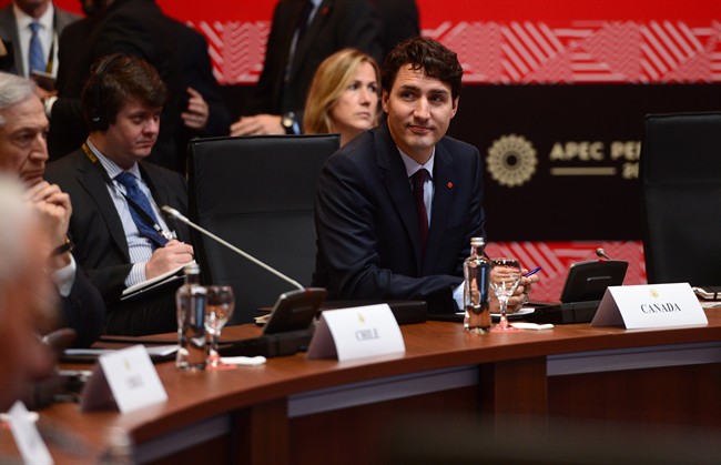 Prime Minister Justin Trudeau takes part in a TPP meeting during the APEC Summit in Lima, Peru on Saturday, Nov. 19, 2016.