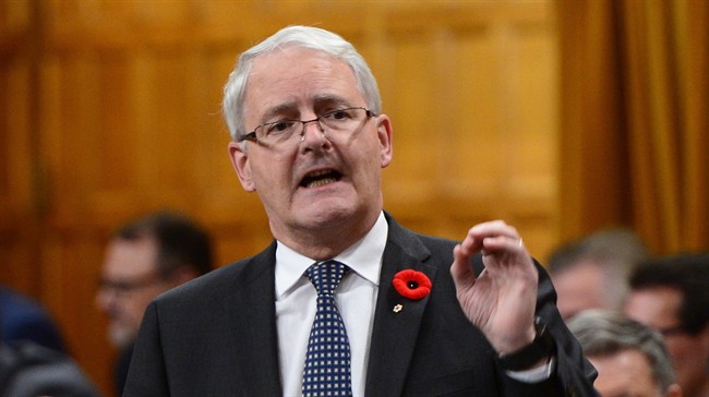 Minister of Transport Marc Garneau stands during question period in the House of Commons on Parliament Hill in Ottawa on Monday, Oct. 31, 2016.