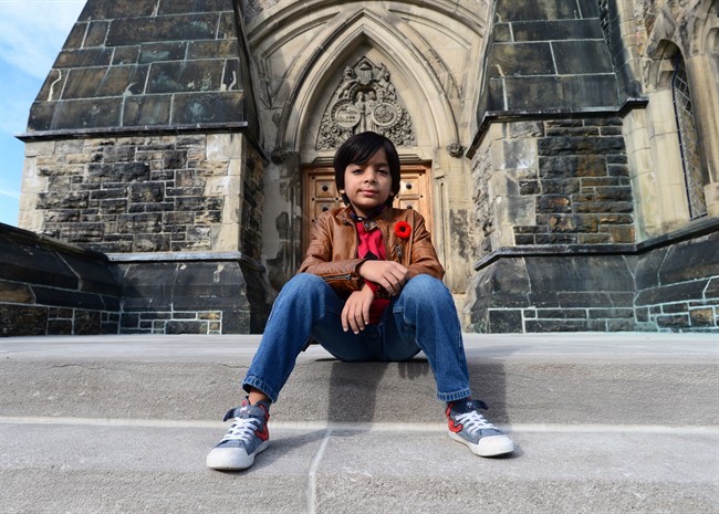 Adam Ahmed, 7, of Markham, Ont., poses for a photo on Parliament Hill in Ottawa on Tuesday, Nov. 8, 2016. Ahmed has been repeatedly flagged at the airport because his name matches one on a security list.