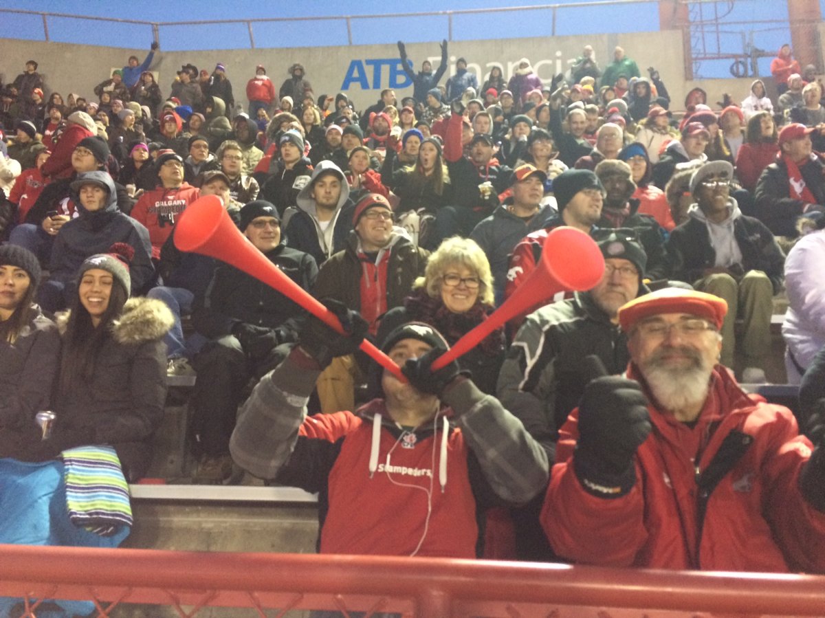 Stamps fans celebrate Calgary's win over the B.C. Lions at McMahon Stadium Sunday.
