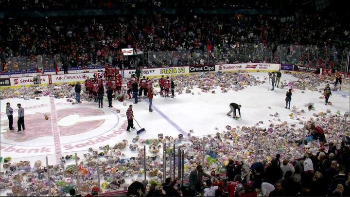 Stuffed animals being tossed on the ice at the 2016 Calgary Hitmen Teddy Bear Toss.