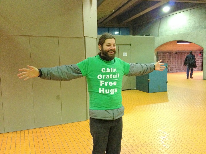 In this November 2016 photo, Tommy Boucher stands in the Montreal Metro to give free hugs.