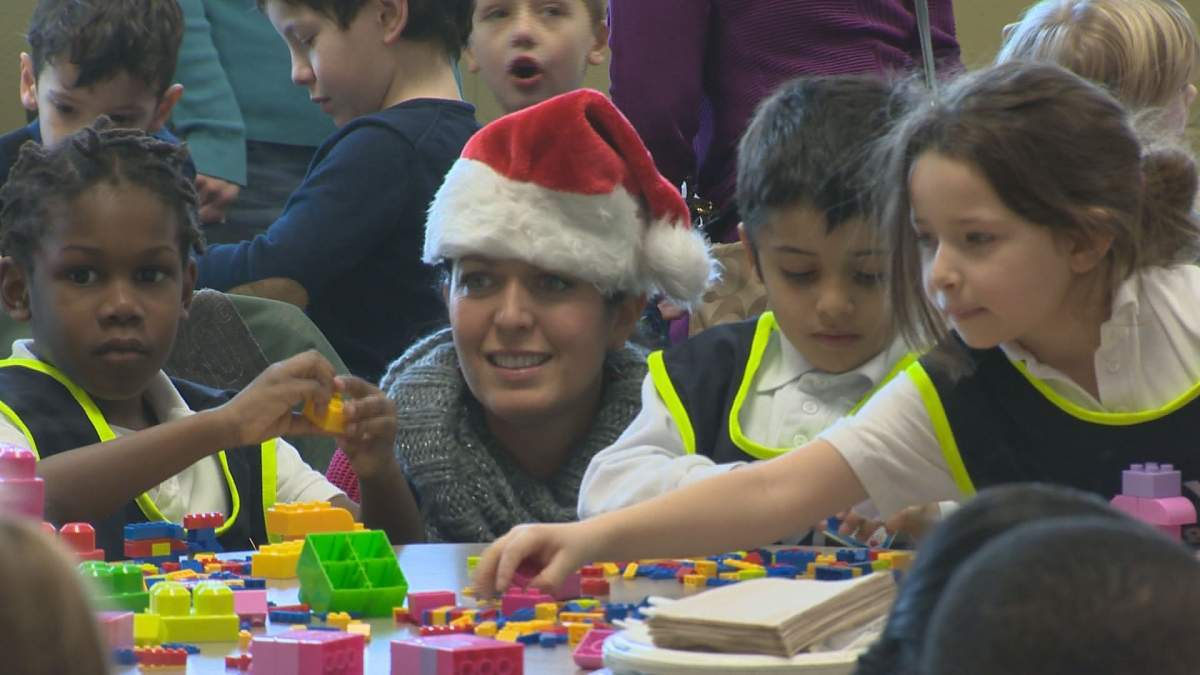 Children play at a fundraiser for the Generations Foundation Food and Toy Drive.