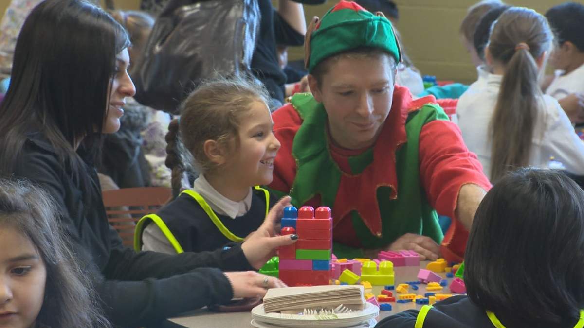 Children play at a fundraiser for the Generations Foundation Food and Toy Drive.