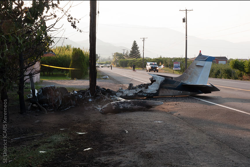 This RCMP photograph from the TSB report shows the charred wreckage of the plane in the aftermath of its crash landing near Highway 97.