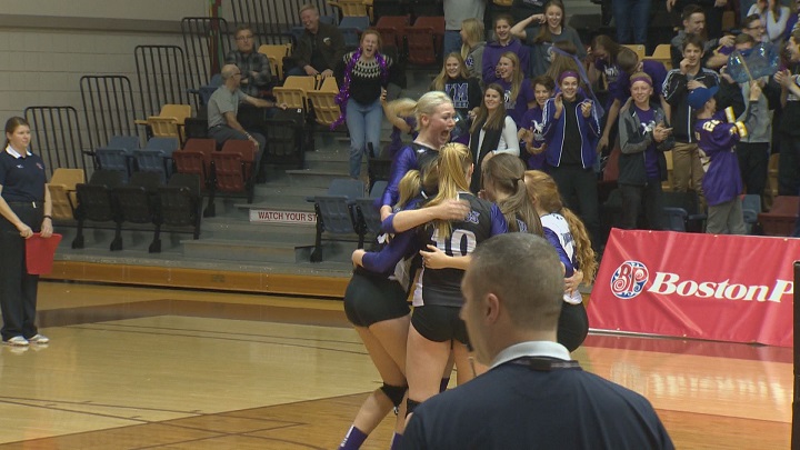The Vincent Massey Vikings celebrate their win in the AAAA Girls Volleyball Provincial Semifinals.
