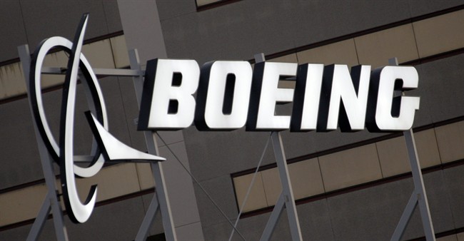 In this Jan. 25, 2011 file photo, the Boeing Company logo on the property in El Segundo, Calif. 