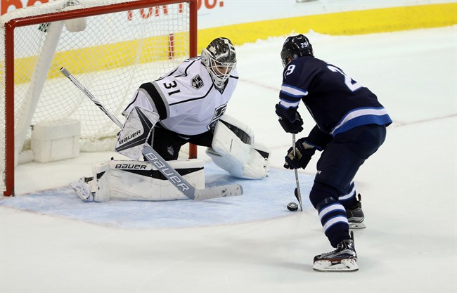 Winnipeg Jets' Patrik Laine scores on Los Angeles Kings goaltender Peter Budaj during the shootout at MTS Centre on Sunday.