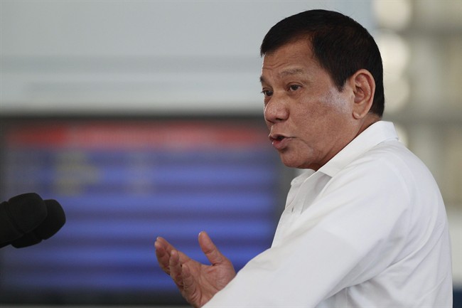Philippine President Rodrigo Duterte gestures during his speech at Manila's International Airport, Philippines on Wednesday, Nov. 9, 2016. Duterte, who has lashed out at Barack Obama for criticizing his deadly anti-drug crackdown, congratulated U.S. President-elect Donald Trump Wednesday and said he looks forward to working with the new American leader to further enhance the treaty allies' relations. (AP Photo/Aaron Favila).