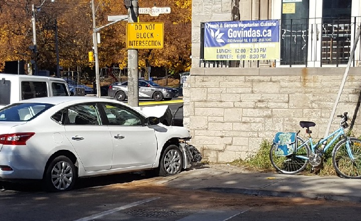 Police investigate the scene of a three-vehicle collision in Toronto on Nov. 7, 2016.