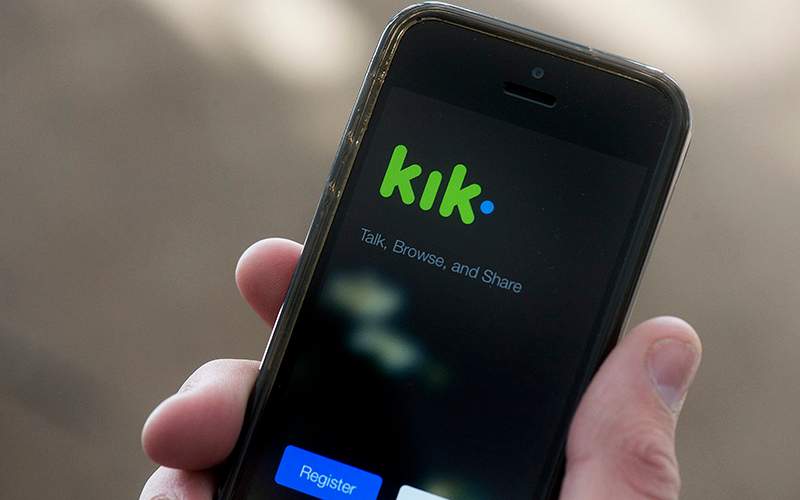 A teenage boy uses the Kik messenger app in Montreal, Monday, February 15, 2016.
