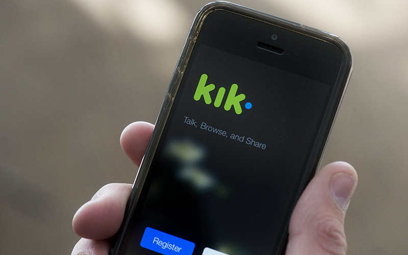 A teenage boy uses the Kik messenger app in Montreal, Monday, February 15, 2016.