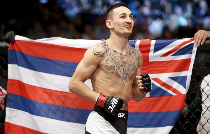 In this Dec. 12, 2015 file photo, Max Holloway warms up before fighting Jeremy Stephens in a featherweight mixed martial arts bout at UFC 194 in Las Vegas. The UFC took another step toward filling Conor McGregor's sizable featherweight shoes when Max Holloway took on Anthony Pettis in the main event of UFC 206 on Saturday night in Toronto. Dec. 10, 2016.