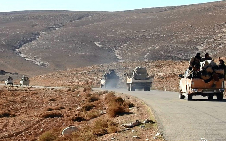 A convoy of IS vehicles driving in a desert area of east of Palmyra city, in Homs, Syria.