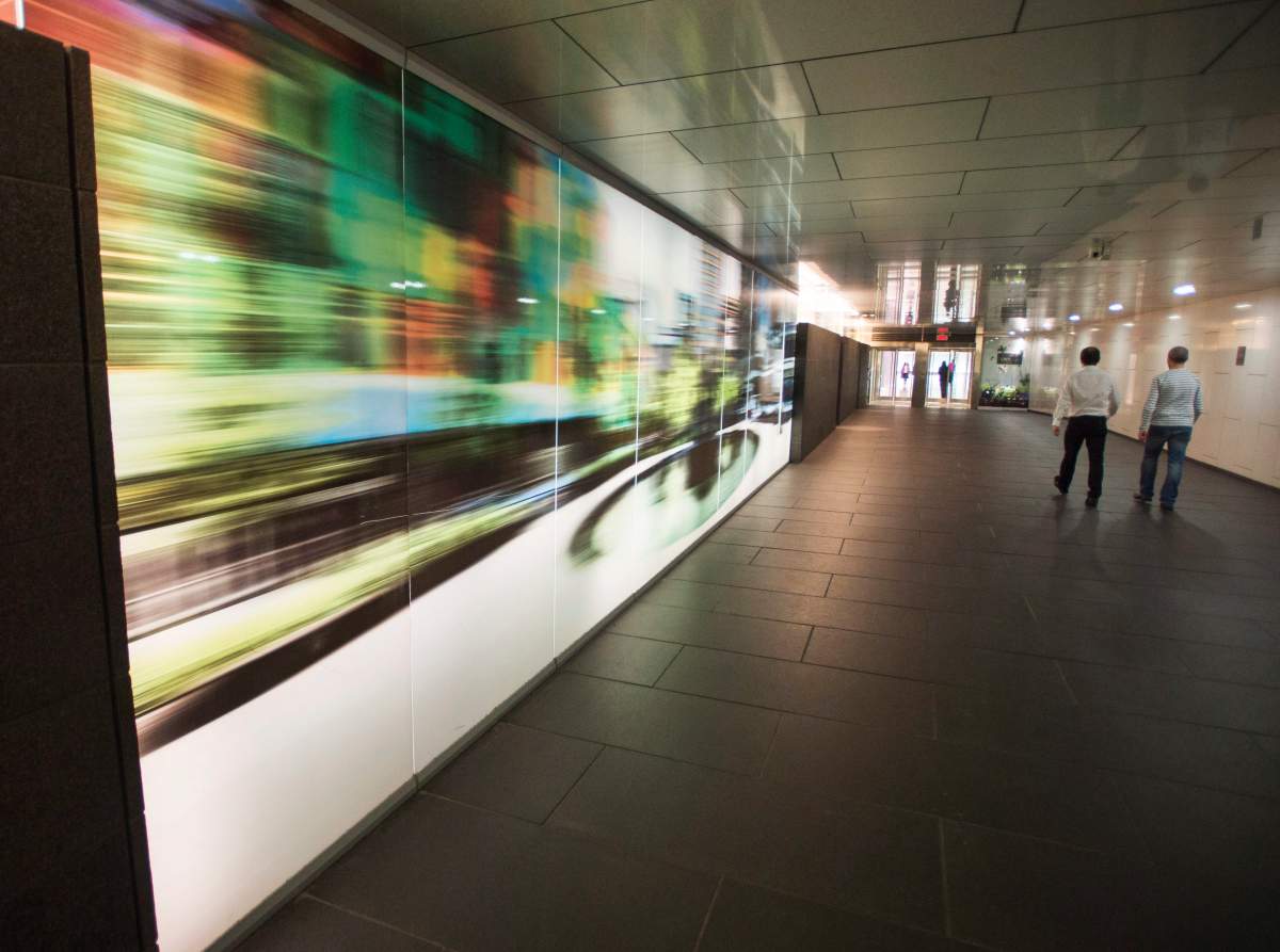 Artwork lines the walls of many of the tunnels that connect the underground city network Friday, December 9, 2016 in Montreal.