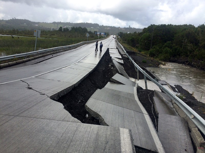 A damaged road is seen after a quake at Tarahuin, on Chiloe island, southern Chile, December 25, 2016. 