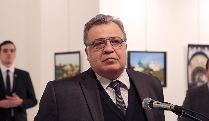 The Russian Ambassador to Turkey Andrey Karlov speaks a gallery in Ankara Monday Dec. 19, 2016.