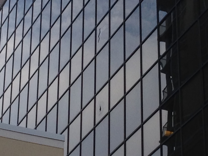 Broken windows caused by scaffolding collapse in Calgary – Dec 22, 2016