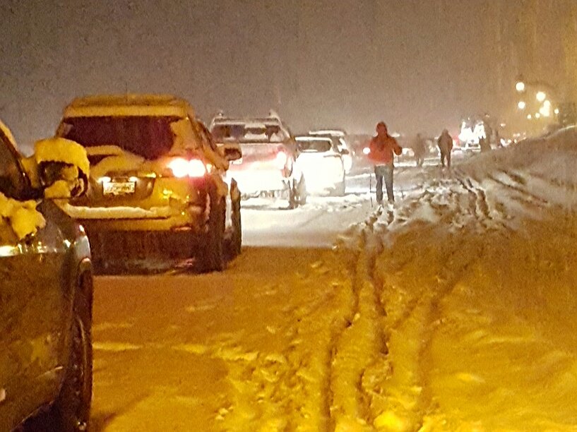 Some take to skis to pass time while stuck on the Coquihalla Highway Thursday evening.