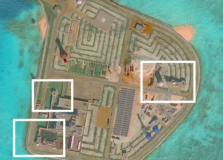 A satellite image shows what CSIS Asia Maritime Transparency Initiative says appears to be anti-aircraft guns and what are likely to be close-in weapons systems (CIWS) on the artificial island Johnson Reef in the South China Sea in this image released on December 13, 2016. 