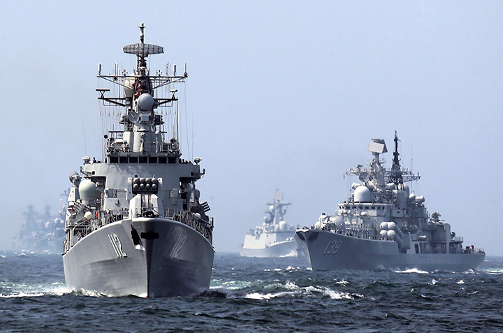 In this May 24, 2014 photo, China's Harbin guided missile destroyer and DDG-139 Ningbo Sovremenny class Type-956EM destroyer, right, take part in a week-long China-Russia "Joint Sea-2014" navy exercise at the East China Sea off Shanghai, China. 
