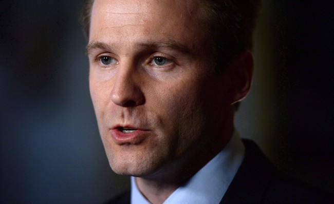 New Brunswick Premier Brian Gallant speaks to the media in the foyer of the House of Commons in Ottawa on Thursday, May 12, 2016. 
