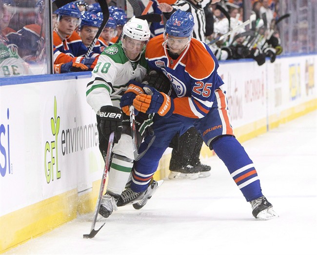 Dallas Stars' Lauri Korpikoski (38) and Edmonton Oilers' Darnell Nurse (25) battle for the puck during third period NHL action in Edmonton, Alta., on Friday November 11, 2016.