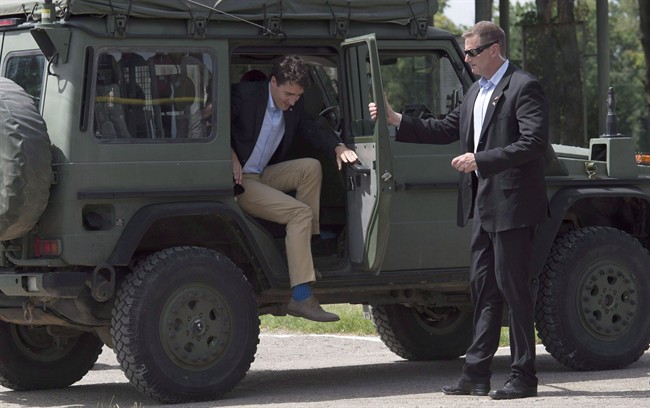 Prime Minister Justin Trudeau gets out of a Canadian military G-wagon as he tours the International Peacekeeping and Security Centre near Yavoriv, Ukraine Tuesday July 12, 2016.