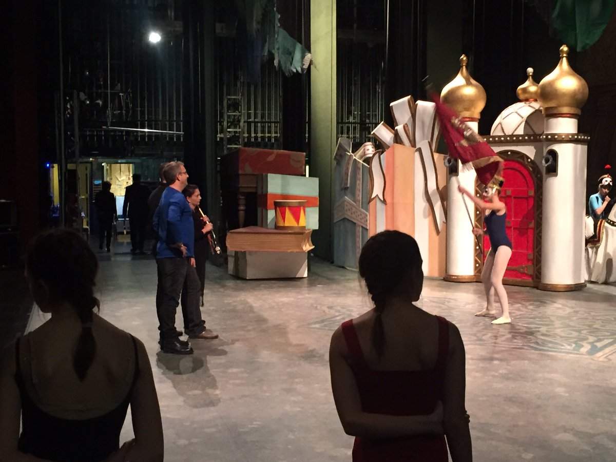 Young dancers watch from the wings as Alberta Ballet Artistic Director Jean Grand-Maitre directs one of the “toy soldiers” on stage.