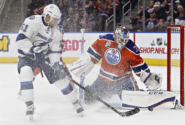 Tampa Bay Lightning' Valtteri Filppula (51) is stopped by Edmonton Oilers' goalie Cam Talbot (33) during third period NHL action in Edmonton, Alta., on Saturday December 17, 2016.