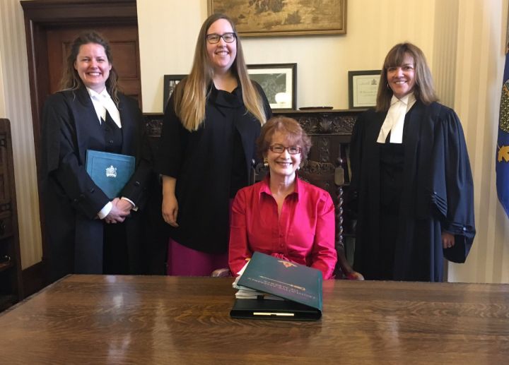 Alberta Minister Responsible for Democratic Renewal Christina Gray (second from left) attends official signing of Bill 35, the Fair Elections Financing Act, on Dec. 14, 2016.