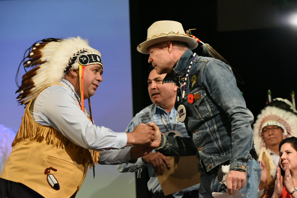 Gord Downie shakes hands with Regional Chief Morley Googoo during an Assembly of First Nations meeting Tuesday, where he was presented with artwork from two Nova Scotia Mi’kmaq artists.