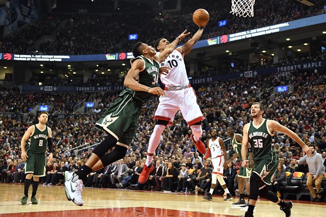 Toronto Raptors guard DeMar DeRozan (10) is fouled on his way to the net by Milwaukee Bucks forward Giannis Antetokounmpo (34) during first half NBA basketball action in Toronto on Monday, Dec. 12, 2016. THE CANADIAN PRESS/Frank Gunn.