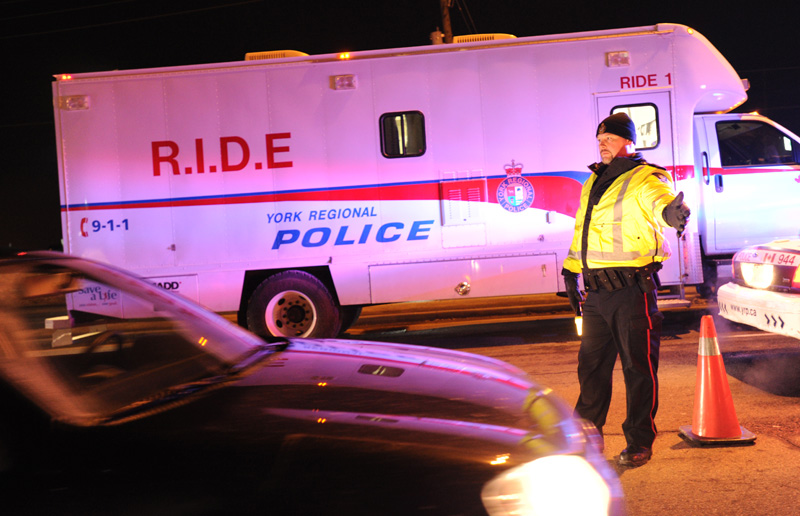 Officers north of Toronto run an impaired-driving checkpoint in this file image.