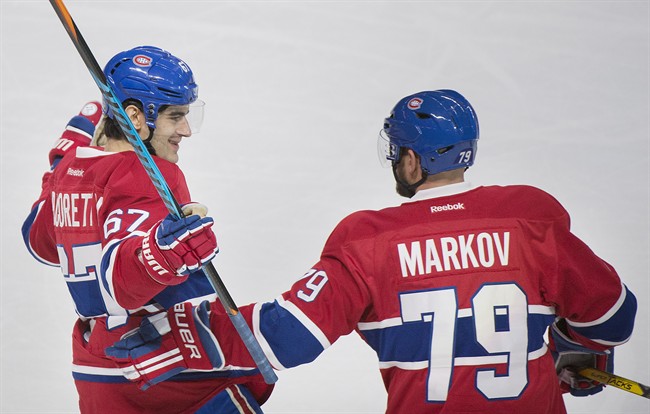 Montreal Canadiens' Max Pacioretty celebrates with Andrei Markov after scoring a goal.