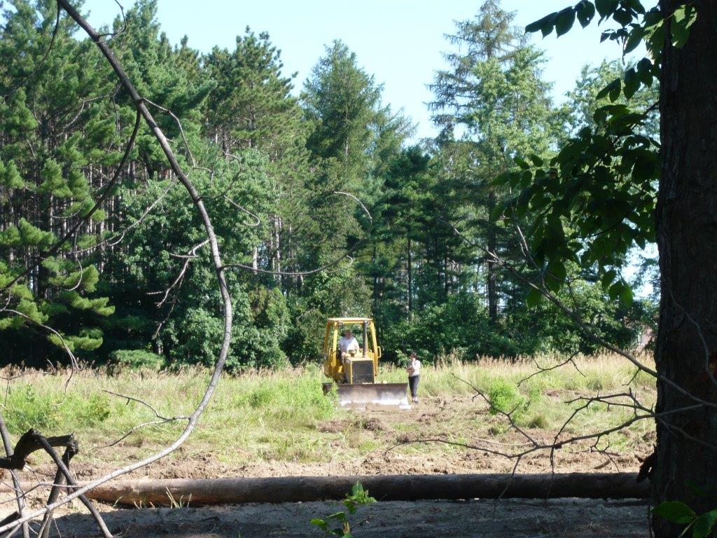 A bulldozer clearing land at 230 Grand Trunk in Vaughan.