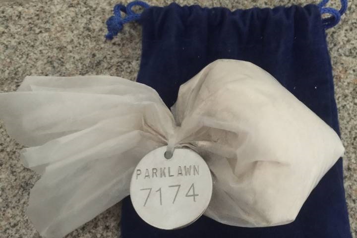 What the metal disc with a cremation number looks like.