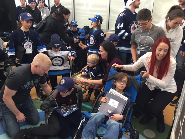 Winnipeg Jets players visit the Children's Rehabilitation Centre.