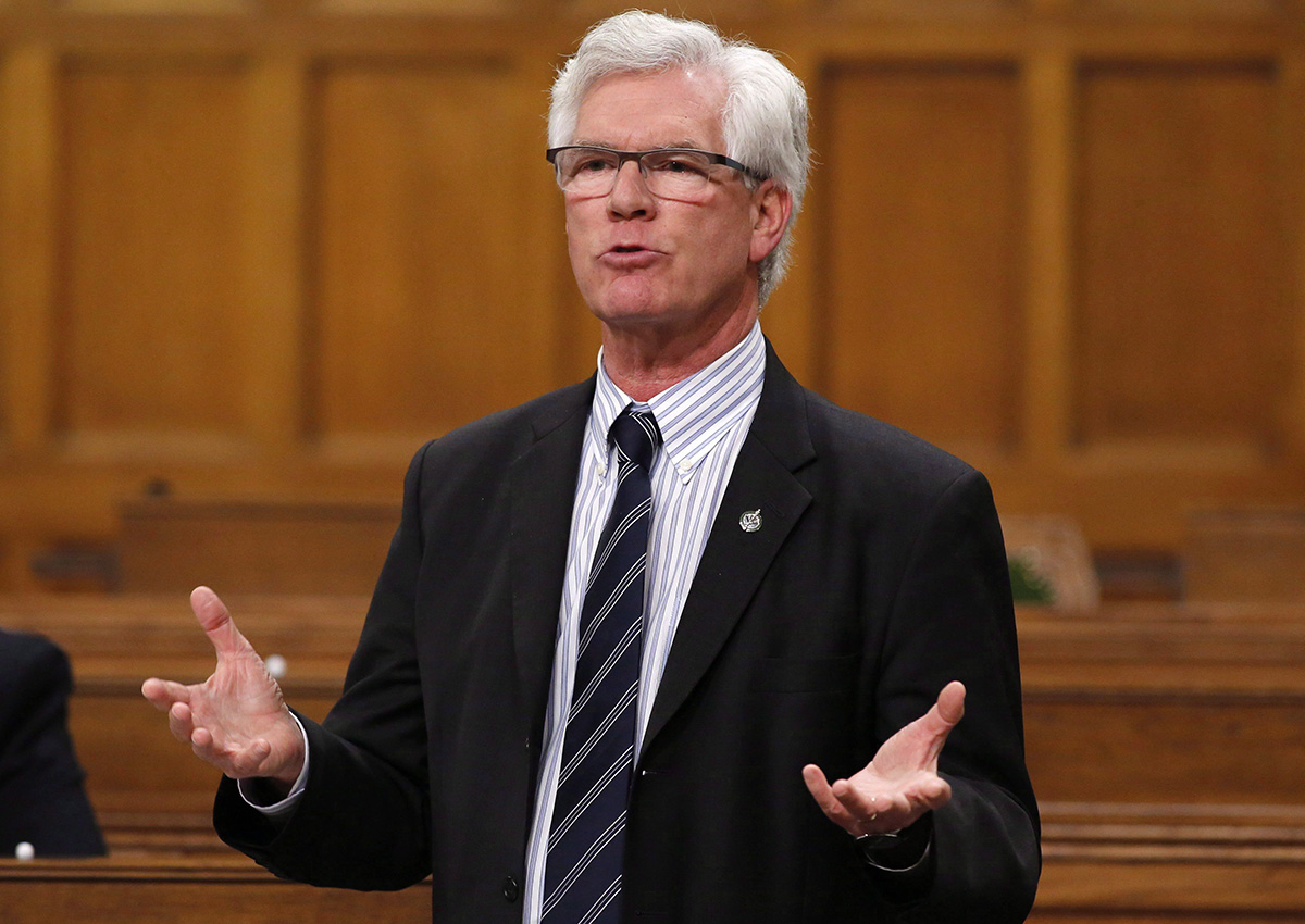 Natural Resources Minister Jim Carr stands in the House of Commons during question period, in Ottawa on Friday, December 9, 2016. 