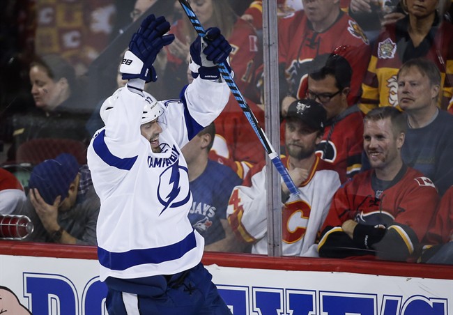 Tampa Bay Lightning's Alex Killorn celebrates his goal during third period NHL hockey action against the Calgary Flames in Calgary, Wednesday, Dec. 14, 2016.