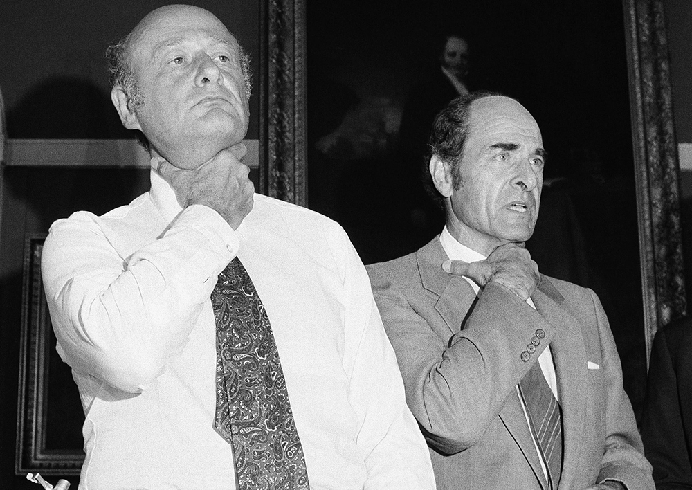  In this Aug. 7, 1981, file photo, Dr. Henry Heimlich, right, and Mayor Edward Koch demonstrate how a chocking victim should signal for help at New York's City Hall during Heimlich's discussion of his Heimlich Maneuver. 