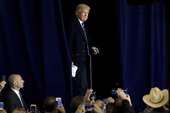 President-elect Donald Trump arrives for a rally in a DOW Chemical Hanger at Baton Rouge Metropolitan Airport, Friday, Dec. 9, 2016, in Baton Rouge, La. 